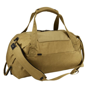 Thule tan duffel bag with top handles and adjustable shoulder strap