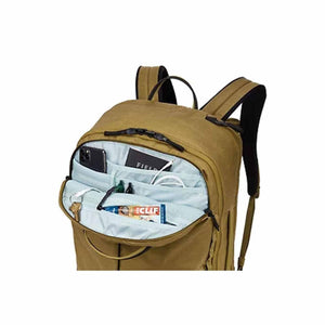 Thule backpack with open front pocket showing internal organization compartments