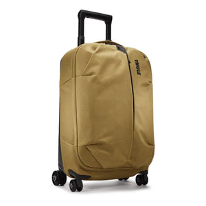 Tan Thule carry on luggage with four wheels and an extendable handle
