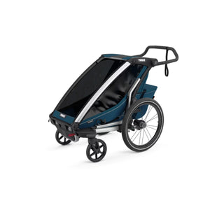 Thule blue child carrier trailer with black wheels and adjustable handlebar
