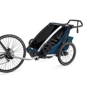 Thule blue bike trailer with a front wheel attachment and handle