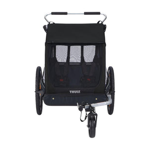 Thule black two-seat child bike trailer with mesh front and front wheel attachment