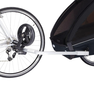 Thule bike trailer hitch arm connected to a bicycle rear wheel