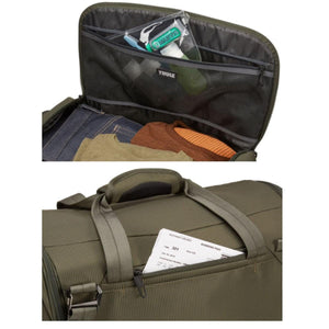 Thule travel bag interior with mesh pockets and exterior zippered pocket holding a boarding pass