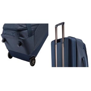 Thule blue rolling luggage showing wheels and extendable handle