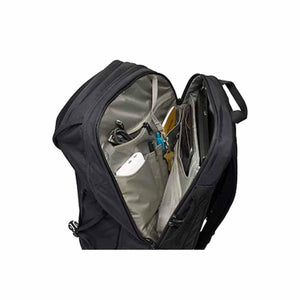 Open Thule black backpack showing internal organization pockets and laptop sleeve