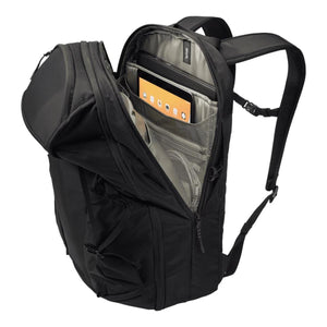 Thule black backpack with open main compartment showing laptop and tablet sleeves