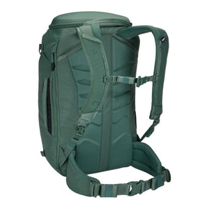 Back view of green Thule backpack showing padded shoulder straps and waist belt