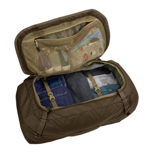 Open Thule duffel bag with internal mesh pocket and compression straps holding folded clothing