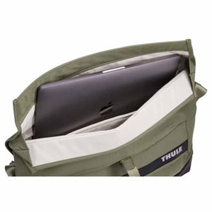 Open Thule bag showing internal laptop sleeve with laptop inside