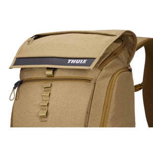 Tan Thule backpack with flap closure and front zipper pocket