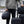 Person holding multiple black Thule travel bags and luggage