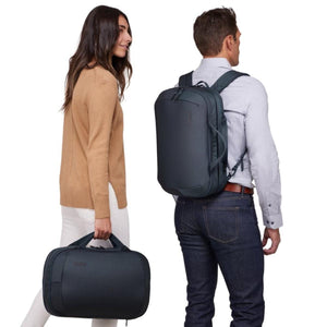 Man wearing a Thule backpack and woman carrying a Thule briefcase