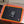 Toasti heated mouse pad with glowing orange border and computer mouse on desk