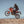 Rider wearing Tourmaster gear on a Honda motorcycle jumping over a desert hill