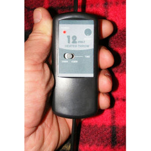 Trillium Worldwide 12 volt heated throw controller held in hand
