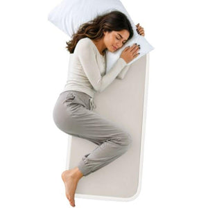 Person sleeping on a Cool Care Technologies cooling mattress pad