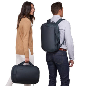Man wearing a Thule backpack and woman carrying a Thule briefcase