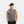 Man wearing a grey Mission sleeveless shirt and a black Mission visor
