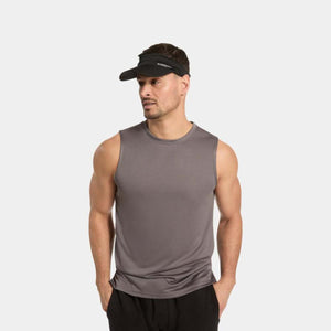 Man wearing a grey Mission sleeveless shirt and a black Mission visor