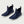 Pair of navy blue Huk ankle boots with white soles
