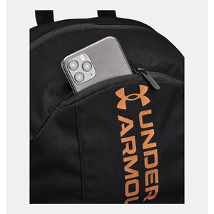Under Armour backpack with smartphone in the zippered front pocket