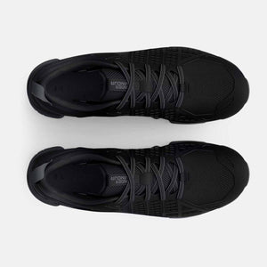 Top view of black Under Armour athletic shoes with laces