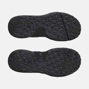 Under Armour black shoe outsoles with slip resistant tread pattern