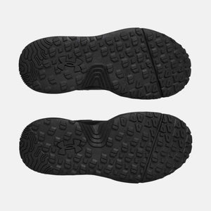 Under Armour black shoe outsoles with textured lug pattern