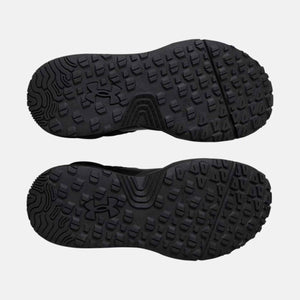 Under Armour black shoe outsoles with textured tread pattern