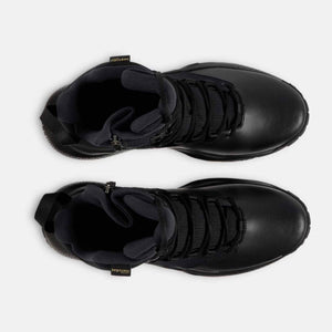 Top view of black Under Armour tactical boots with side zippers and lace up closure
