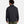 Back view of a person wearing a black Under Armour softshell jacket