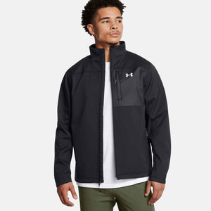 Man wearing a black Under Armour softshell jacket with a chest pocket and white logo