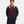 Man wearing a black Under Armour hooded windbreaker jacket