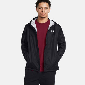 Man wearing a black Under Armour hooded windbreaker jacket