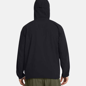 Back view of a black Under Armour hooded windbreaker jacket