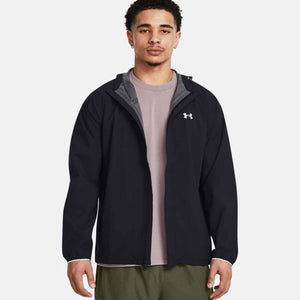 Man wearing a black Under Armour zip up hooded jacket
