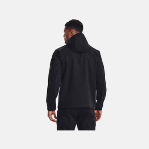 Back view of a man wearing a black Under Armour hooded jacket