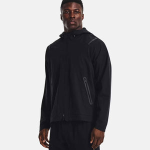 Man wearing a black Under Armour hooded zip up jacket