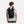Person wearing a black Under Armour roll top backpack with bungee cord detail