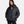 Woman wearing a black Under Armour hooded puffer jacket