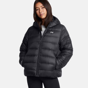 Woman wearing a black Under Armour hooded puffer jacket