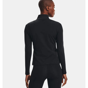 Back view of a person wearing a black Under Armour long sleeve mock neck top