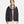 Woman wearing a black Under Armour hooded windbreaker jacket