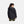 Back view of a person wearing a black Under Armour hooded jacket