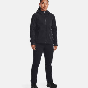 Woman wearing black Under Armour hooded softshell jacket and matching trousers