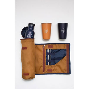 United by Blue travel kit with bottle, two cups, and metal straws in a brown roll up case