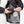 Person connecting battery pack to Venture Heat jacket interior pocket