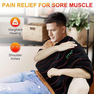 Man using a UTK Technology weighted heating pad on his shoulder for muscle pain relief