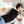 UTK Technology weighted heating pad with tourmaline beads on a person sitting on a sofa